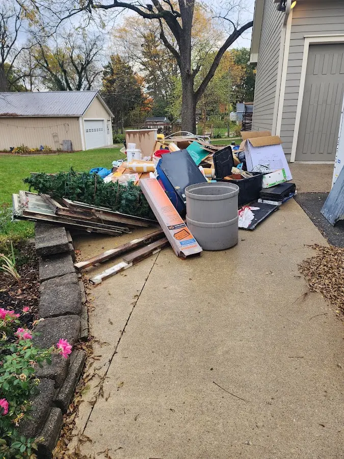 Dumpster being loaded with debris for Estate Cleanout Dumpster Rental in Tamaqua